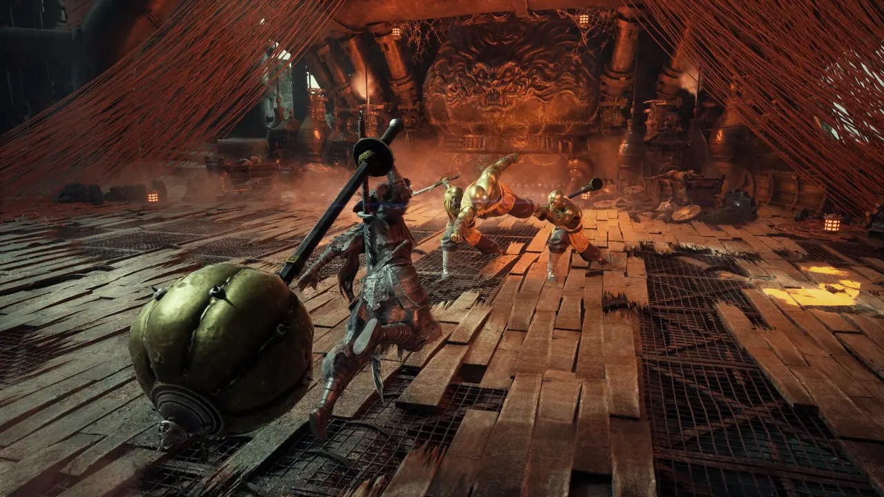 Combat inside a timber hall lit by orange firelight